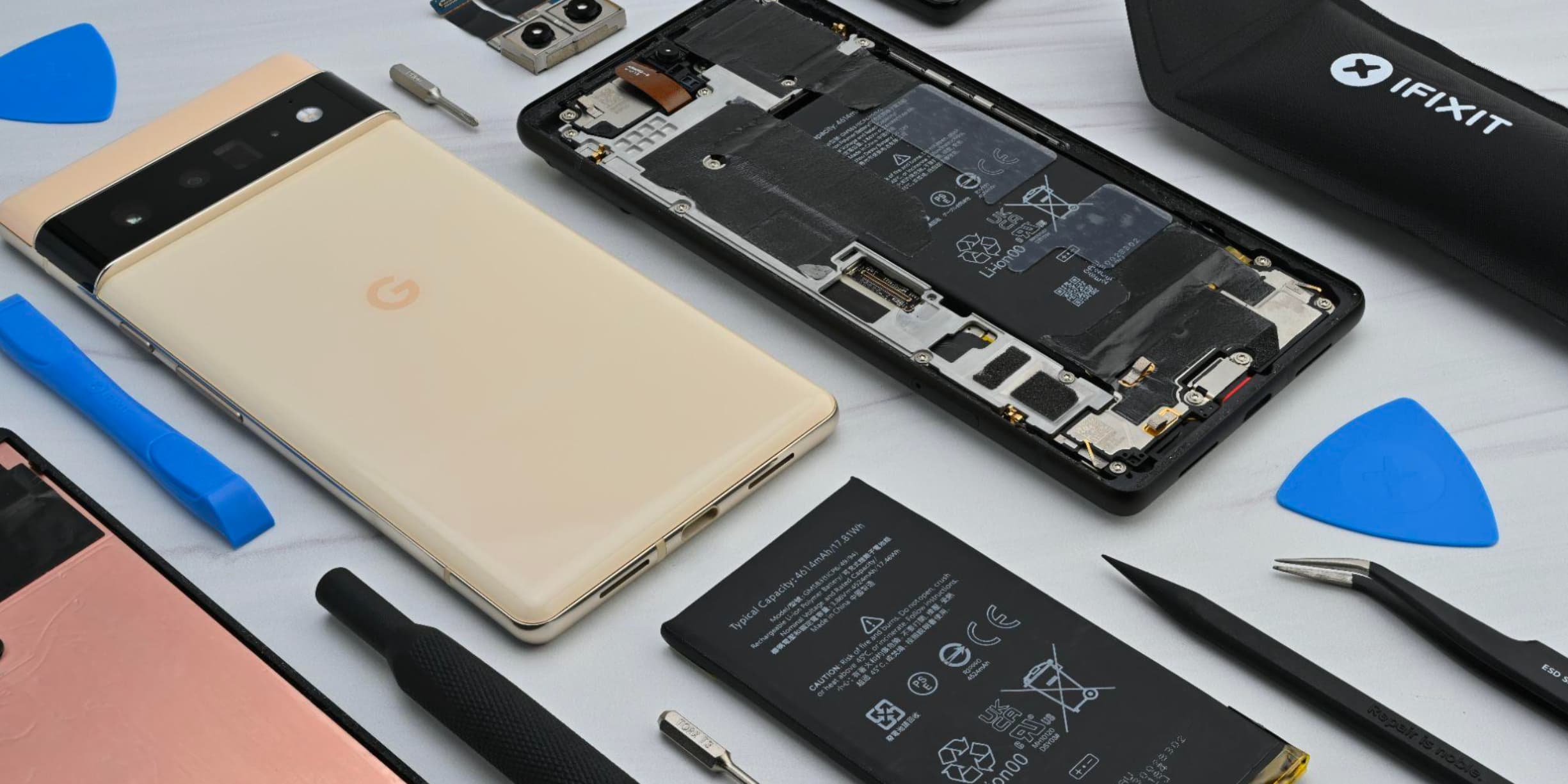 Technician repairing a Google Pixel phone at the ASM Wireless bench